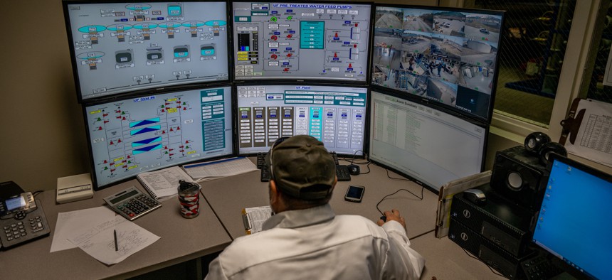 A technician monitoring control systems at a water treatment plant in Eagle Pass, Texas. The EPA recently backed away from a plan to require water systems to report on cybersecurity measures as part the agency's sanitary survey requirements.