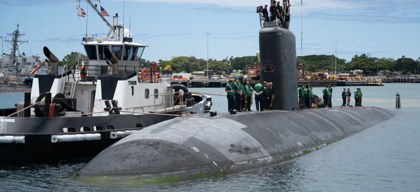 The Los Angeles-class fast-attack submarine USS Topeka (SSN 754) pulls into port following a routine underway, June 16, 2022. 