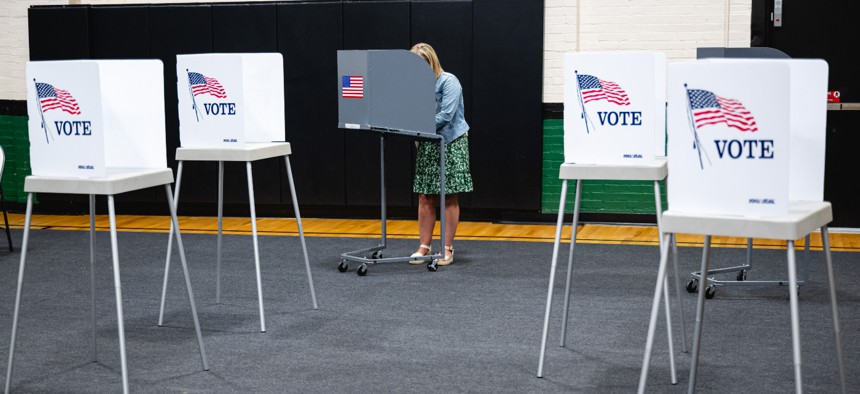 A voter marks a ballot during Kentucky’s primary elections in May 2023.