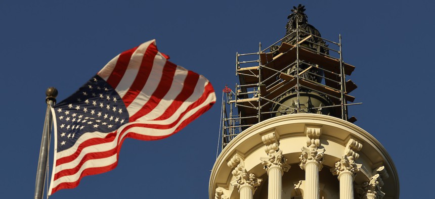 Scaffolding partially covers the bronze Statue of Freedom on the top of the U.S. Capitol Dome on Oct. 25, 2023.
