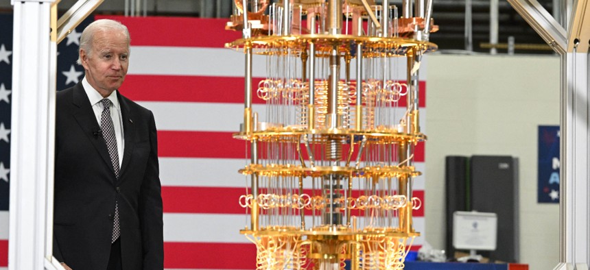 US President Joe Biden looks at quantum computer as he tours the IBM facility in Poughkeepsie, New York, on October 6, 2022.