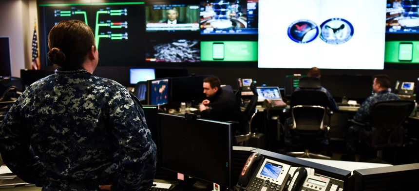 Sailors stand watch in the Fleet Operations Center at the headquarters of U.S. Fleet Cyber Command/U.S.