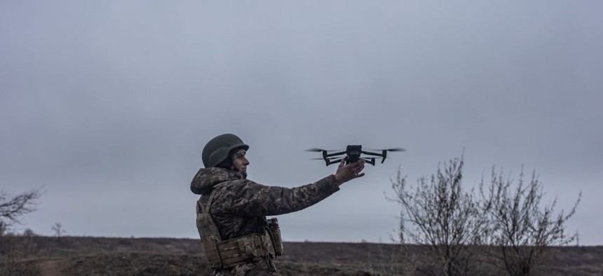 A Ukrainian soldier catches a drone after a flight during training in Donetsk Oblast, Ukraine on November 25, 2023.