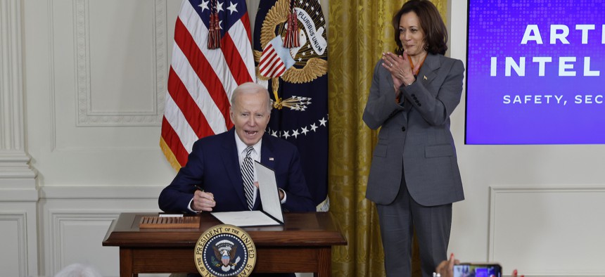 President Biden signs the executive order on artificial intelligence during a White House event on October 30, 2023.