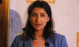 FTC Chair Lina Khan, shown here speaking at Economic Club of New York in July 2023, is looking to expand the authorities her agency has to target fraudsters who use impersonation in scams.