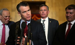 U.S. Sen. Todd Young (R-IN) speaks as (L-R) Senate Minority Leader Sen. Chuck Schumer (D-NY), Sen. Martin Heinrich (D-NM) and Sen. Michael Rounds (R-SD) listen after a meeting on AI at the Kennedy Caucus Room at Russell Senate Office Building on November 1, 2023. Young said on Feb. 29 that Senate committees should expect to start marking up AI legislation soon.