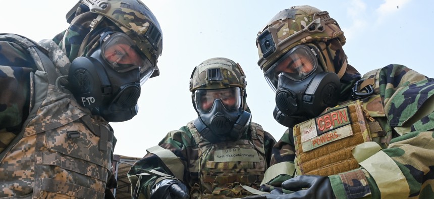 U.S. Air Force personnel wear mission oriented protective posture gear designed for protection in hazardous environments during an an equipment demonstration at Incirlik Air Base in Turkey in August 2023.