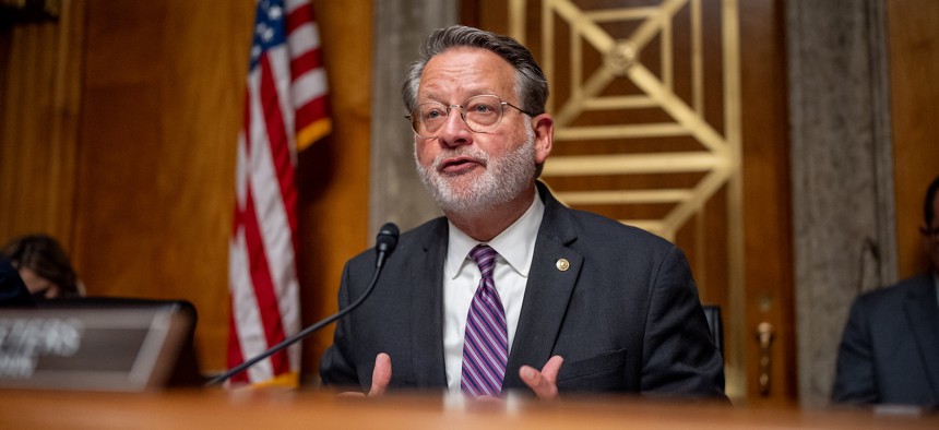 Sen. Gary Peters, D-Mich., shown here at an April 2024 hearing, is floating legislation that would harmonize federal agency cybersecurity regulations.