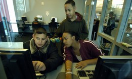 Eighth graders in Aurora, Colo. use their public library's computer lab. The FCC authorized funding to support cybersecurity efforts in schools and libraries across the U.S.