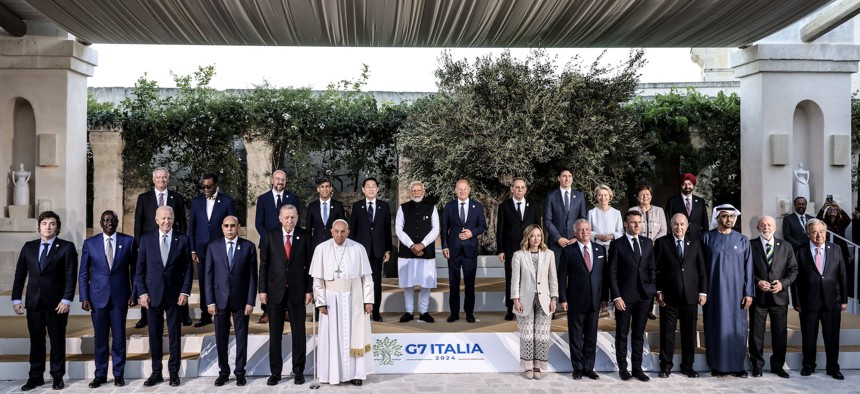 G7 leaders and other world leaders gather for a portrait at the annual conference in Puglia, Italy.