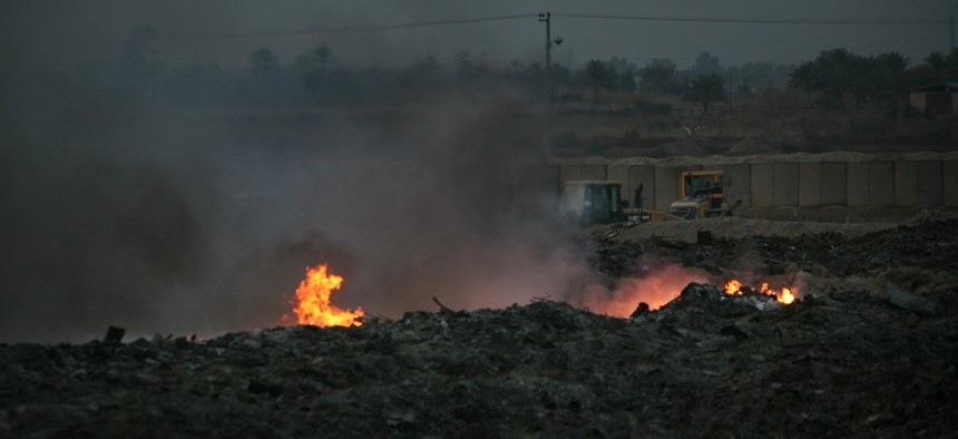 Flames flare out of a burn pit at Camp Taji, north of Baghdad, on Jan. 17, 2010. A registry launched in 2014 to track U.S. personnel exposed to toxic fumes from burn pits is in need of modernization, according to multiple members of Congress and government watchdogs.