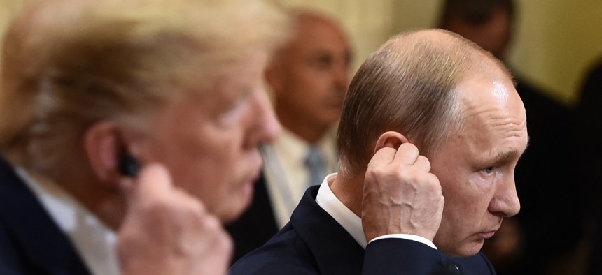 Then-President Donald Trump and Russia's President Vladimir Putin attend a joint press conference after a meeting at the Presidential Palace in Helsinki, on July 16, 2018. A recent assessment by the U.S. intelligence community names Russia as the "preeminent threat" to election in in the runup to the 2024 vote.