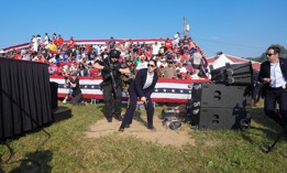 Secret Service agents approach the stage during a campaign rally for former President Donald Trump in Pennsylvania on July 13. Trump ducked and was taken offstage after loud noises were heard after he began speaking. 