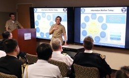 Vice Adm. Kelly Aeschbach, commander of Naval Information Forces, discusses Navy Information Warfare missions and priorities with allied and partner naval attachés during a visit to the Pentagon Feb. 2, 2023.