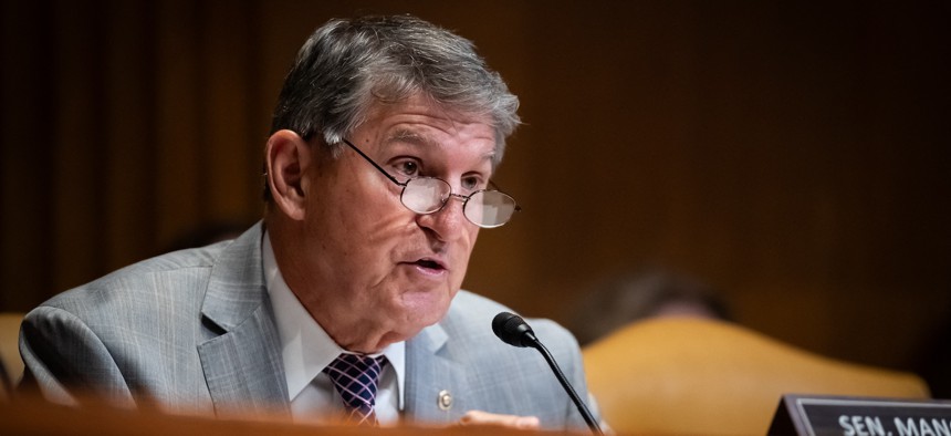 Sen. Joe Manchin, D-W. Va., shown here at a June 4, 2024 Senate hearing, is backing a bill to expand AI capabilities at the Department of Energy and the National Labs.