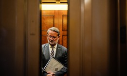 Sen. Gary Peters, D-Mich, shown here departing the Senate chamber after a vote on July 31, 2024, is co-sponsor of a bill that would harmonize various federal agency cybersecurity rules to support easier compliance.