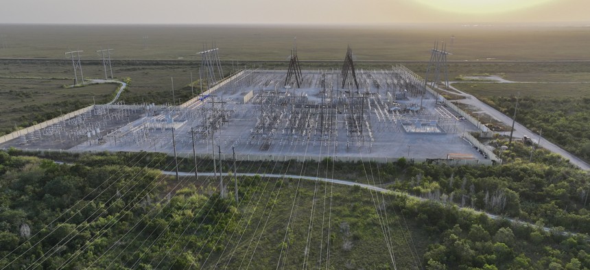 High voltage power lines in West Palm Beach, Florida. The Department of Energy released guidance to help electricity providers manage increased demand from artificial intelligence workloads.