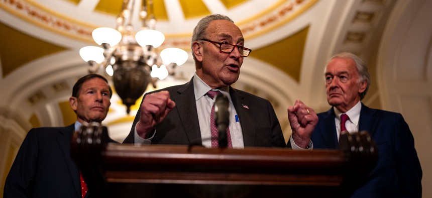 Senate Majority Leader Chuck Schumer speaks to reporters alongside Sens. Richard Blumenthal (L) and Ed Markey (R). Schumer and Markey are asking OMB to do more to mitigate AI bias at federal agencies. 