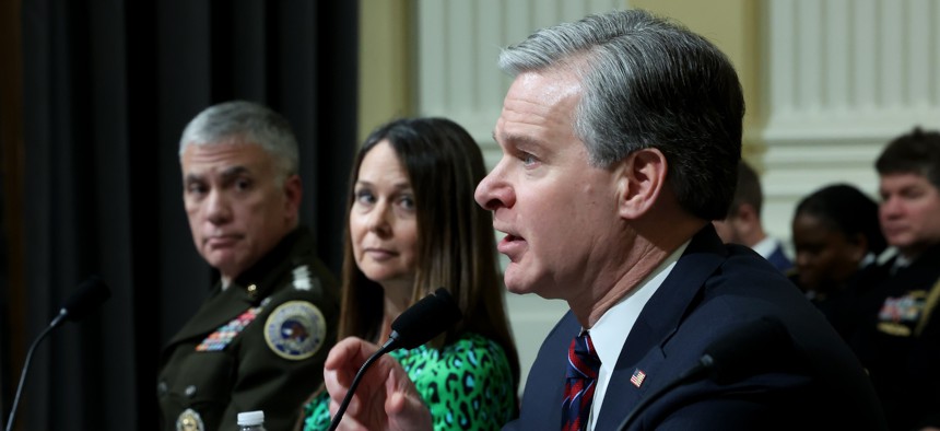 FBI Director Chris Wray is joined by CISA Director Jen Easterly and then-Cyber Command Commander Paul Nakasone at a House committee on China's cybersecurity posture on January 31, 2024. Under a bill being introduced today, Easterly and Wray would lead a joint agency task force focused on the cyber threat from China.