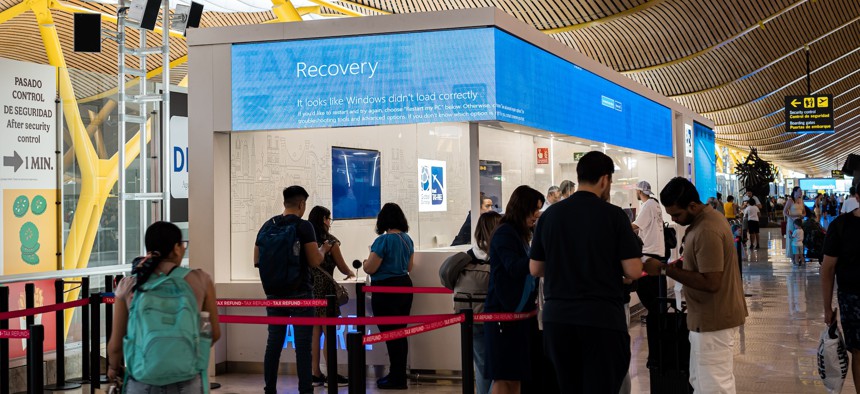 A Windows display reboots at the Madrid-Barajas airport in Spain on July 19, 2024. A faulty update from cybersecurity vendor CrowdStrike led to a worldwide technology outage impacting millions of Windows systems.