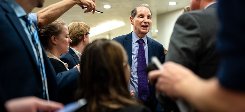 Oregon Democrat Sen. Ron Wyden, a co-sponsor of legislation to give the federal government more authority over health sector cybersecurity, talks to reporters at the Capitol .