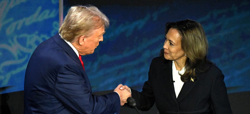  Vice President and Democratic presidential candidate Kamala Harris (right) shakes hands with former President and Republican presidential candidate Donald Trump during a presidential debate at the National Constitution Center in Philadelphia on Sept. 10, 2024. Trump has missed two deadlines for presidential transition preparation activities. 