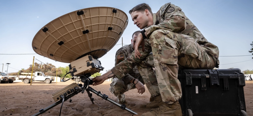 U.S. Army Staff Sgt. Devin Sasser, a network communications systems specialist with 2nd Security Force Assistance Brigade, configures a microwave satellite terminal in Dodji, Senegal, May 27, 2024. 