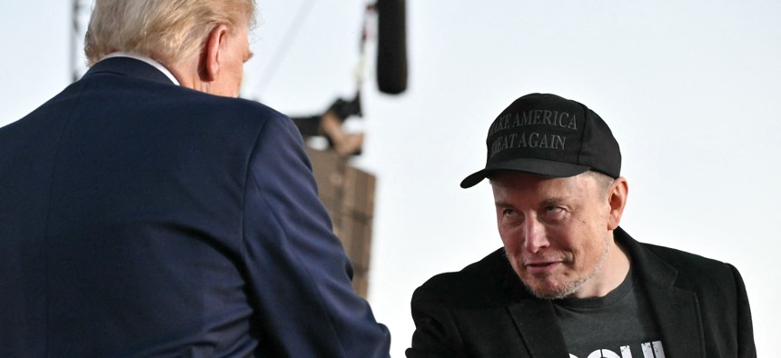 Elon Musk (right) joins former U.S. President and Republican presidential candidate Donald Trump during a campaign rally in Butler, Pa., on Oct. 5, 2024. Trump has said that Musk would lead his proposed government efficiency commission. 