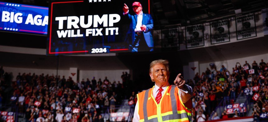 Former President Donald Trump greets supporters during a campaign event at the Resch Center on Oct. 30, 2024 in Green Bay, Wisconsin. The Trump campaign has yet to sign agreements with the GSA and the White House accepting presidential transition aid.