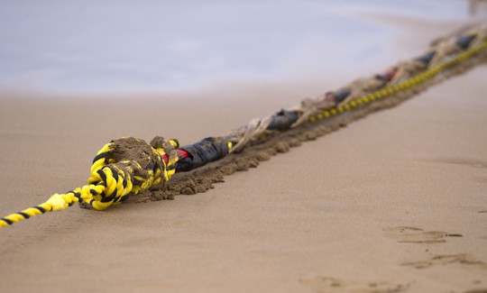 An undersea fiber optic cable is attached to a rope at Arrietara beach near the Spanish Basque village of Sopelana on June 13, 2017.