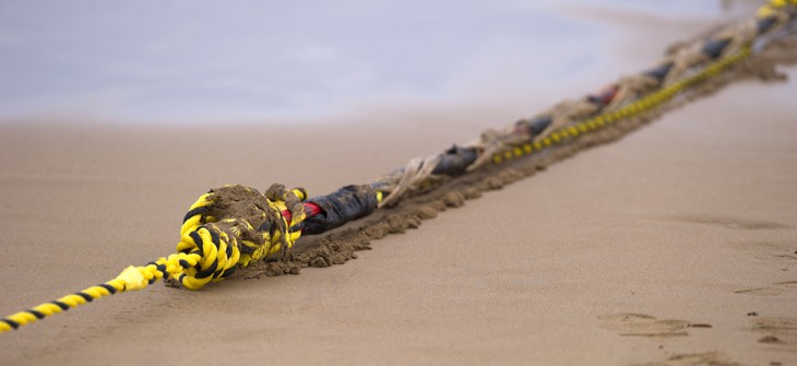 An undersea fiber optic cable is attached to a rope at Arrietara beach near the Spanish Basque village of Sopelana on June 13, 2017.