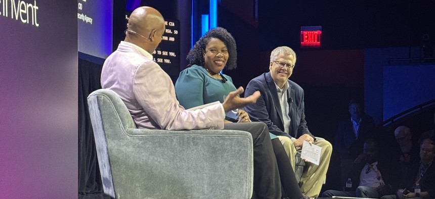  AWS Vice President of Worldwide Public Sector Dave Levy (L), CIA CIO La'Naia Jones and NSA CIO Scott Fear discuss the intelligence community's journey to cloud at the AWS re:Invent event in Las Vegas.