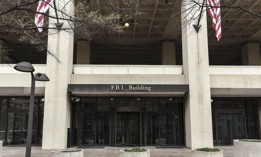 The entrance to the J. Edgar Hoover FBI building in Washington, D.C. The FBI traditionally performs background checks for Senate-confirmed presidential appointees and transition staffers.