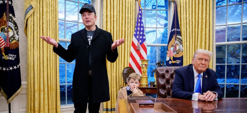 Tesla and SpaceX CEO Elon Musk, accompanied by U.S. President Donald Trump and his son X Musk, speaks during an executive order signing in the Oval Office at the White House on February 11.