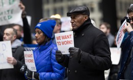 Federal employees rally in support of their jobs outside of the Kluczynski Federal Building on March 19, 2025 in Chicago. 