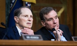Ranking member Sen. Mark Warner, D-Va., right, and Sen. Ron Wyden, D-Ore., listen to testimony during a Senate Select Intelligence Committee confirmation hearing on Thursday, January 30, 2025. Warner and Wyden joined two other Democrats in calling for DHS to reinstate its Cyber Safety Review Board on May 30.