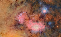 This image combines 678 separate images taken by NSF–DOE Vera C. Rubin Observatory in just over seven hours of observing time. Combining many images in this way clearly reveals otherwise faint or invisible details, such as the clouds of gas and dust that comprise the Trifid nebula (top) and the Lagoon nebula, which are several thousand light-years away from Earth.