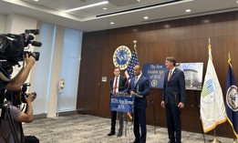 Public Buildings Service Commissioner Michael Peters, Housing and Urban Development Secretary Scott Turner and Virginia Gov. Glenn Youngkin (from left to right) speak at a press conference on June 25. 