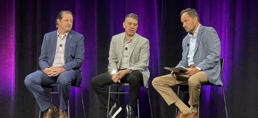 (L to R) Chris Butera, acting executive assistant director in CISA’s cybersecurity division; Robert Costello, CISA’s Chief Information Officer; and Frank Cilluffo, head of McCrary Institute at Auburn, speak onstage Aug. 7 at Black Hat in Las Vegas, Nevada.