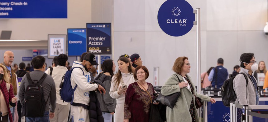 Passengers stand in Clear Plus line that gets them to their gate faster, using their eyes or fingerprints to verification, at Los Angeles International Airport on Wednesday, Jan. 10, 2024 in Los Angeles, CA.