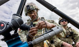 An explosive ordnance disposal soldier with the Army's 18th Military Police Brigade assembles a TiTAN drone-disrupter at U.S. Army Garrison Bavaria on July 8, 2025. 