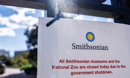 A sign outside the Smithsonian Castle on Oct. 20, 2025, informs visitors of closings due to the government shutdown. 