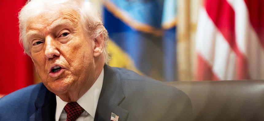 President Donald Trump participates in a roundtable discussion with farmers in the Cabinet Room of the White House on Monday December 8, 2025.