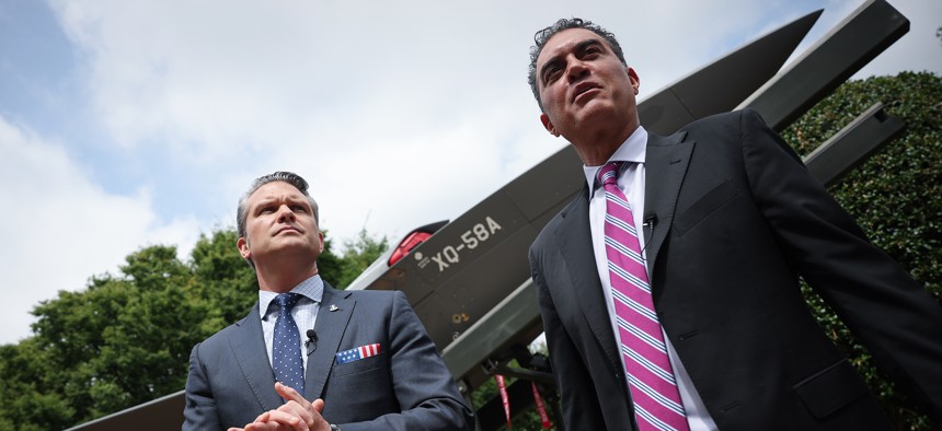 Defense Undersecretary (Research & Engineering) Emil Michael, right, briefs Defense Secretary Pete Hegseth on the XQ-58A Valkyrie drone at the Pentagon on July 16, 2025.