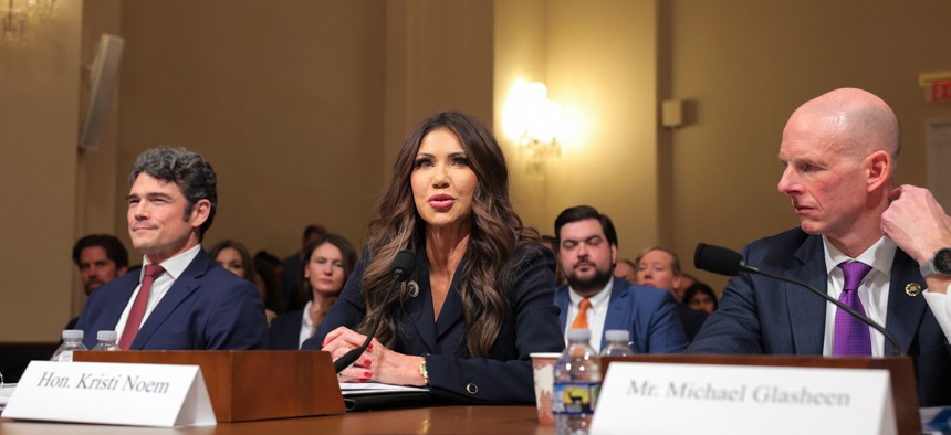 (L-R) Director of the National Counterterrorism Center Joseph Kent, U.S. Secretary of Homeland Security Kristi Noem, and Operations Director of the National Security Branch at the Federal Bureau of Investigation Michael Glasheen testify before the House Committee on Homeland Security in the Cannon House Office Building on December 11, 2025 in Washington, DC. 