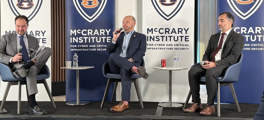 (L-R) Frank J. Cilluffo, director of the McCrary Institute for Cyber and Critical Infrastructure Security at Auburn University, Rep. Andrew Garbarino, R-N.Y., and Drew Bagley, CrowdStrike's vice president and counsel for Privacy and Cyber Policy speak at a McCrary Institute event Dec. 16.