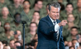 U.S. Secretary of War Pete Hegseth delivers a speech ahead of the arrival of President Donald Trump aboard USS George Washington on October 28, 2025 in Yokosuka, Japan.