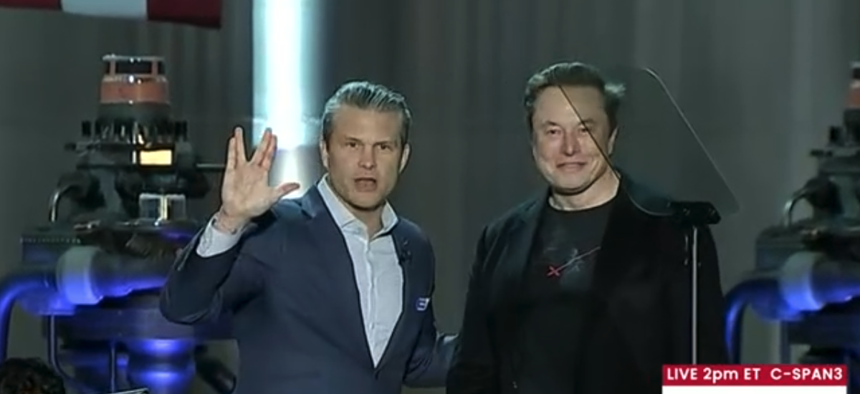 Defense Secretary Pete Hegseth and xAI CEO Elon Musk speak to SpaceX employees on Jan. 12, 2026, in Texas.