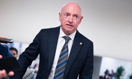  Sen. Mark Kelly, D-Ariz., talks with reporters in the U.S. Capitol after a Senate Armed Services Committee closed briefing on the Iran war on Tuesday, March 10, 2026.