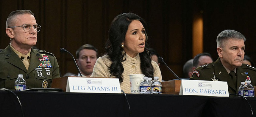 Director of Defense Intelligence Agency (DIA) James Adams III, US Director of National Intelligence Tulsi Gabbard, and Acting Commander of US Cyber Command William Hartman testify during a Senate Committee on Intelligence hearing to examine worldwide threats, on Capitol Hill in Washington, DC, on March 18, 2026.